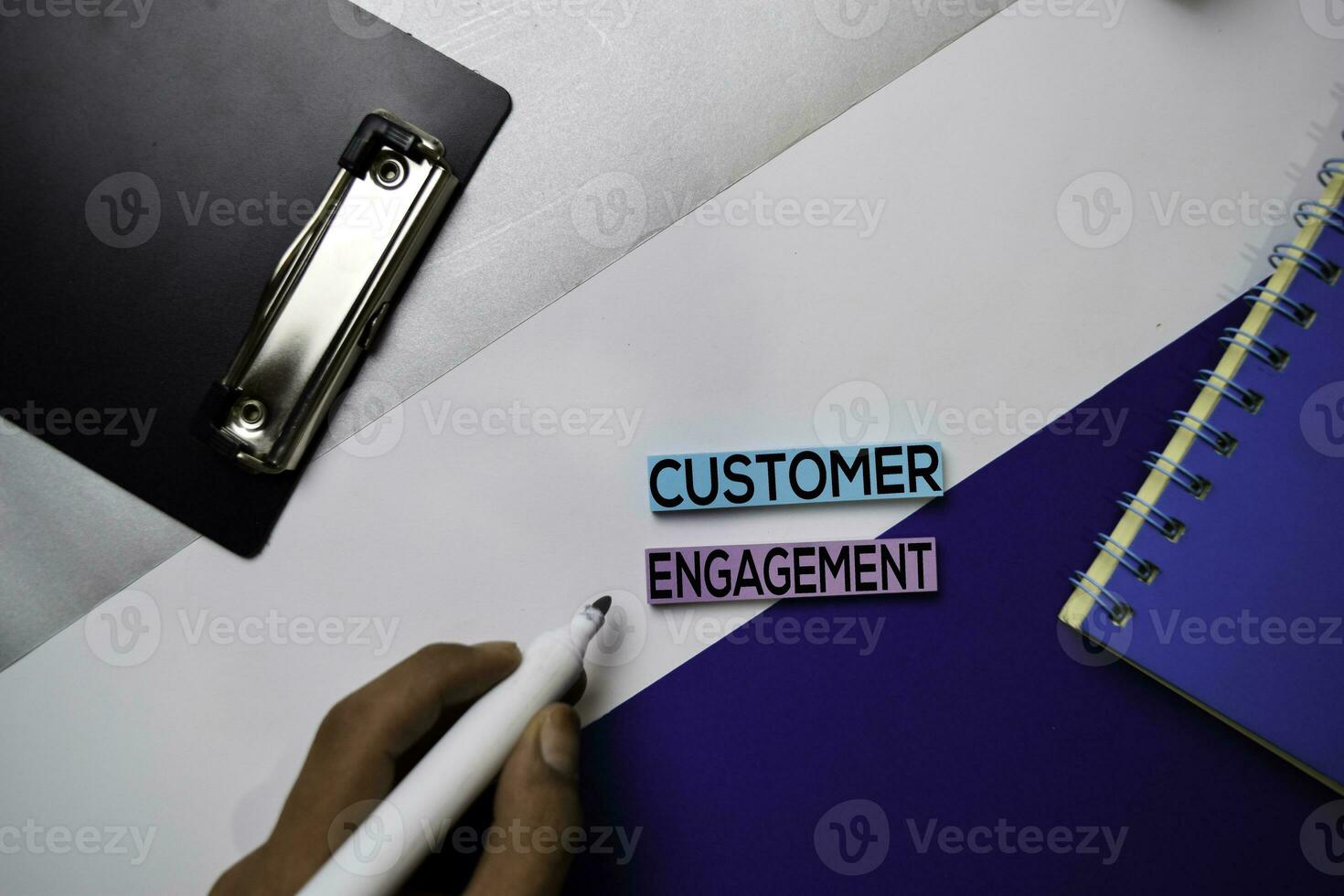 Customer Engagement text on sticky notes with color office desk concept photo