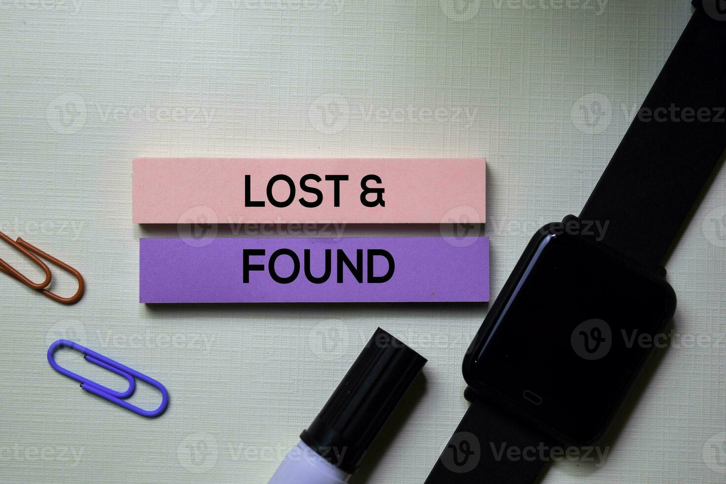 Lost and Found text on sticky notes isolated on office desk photo