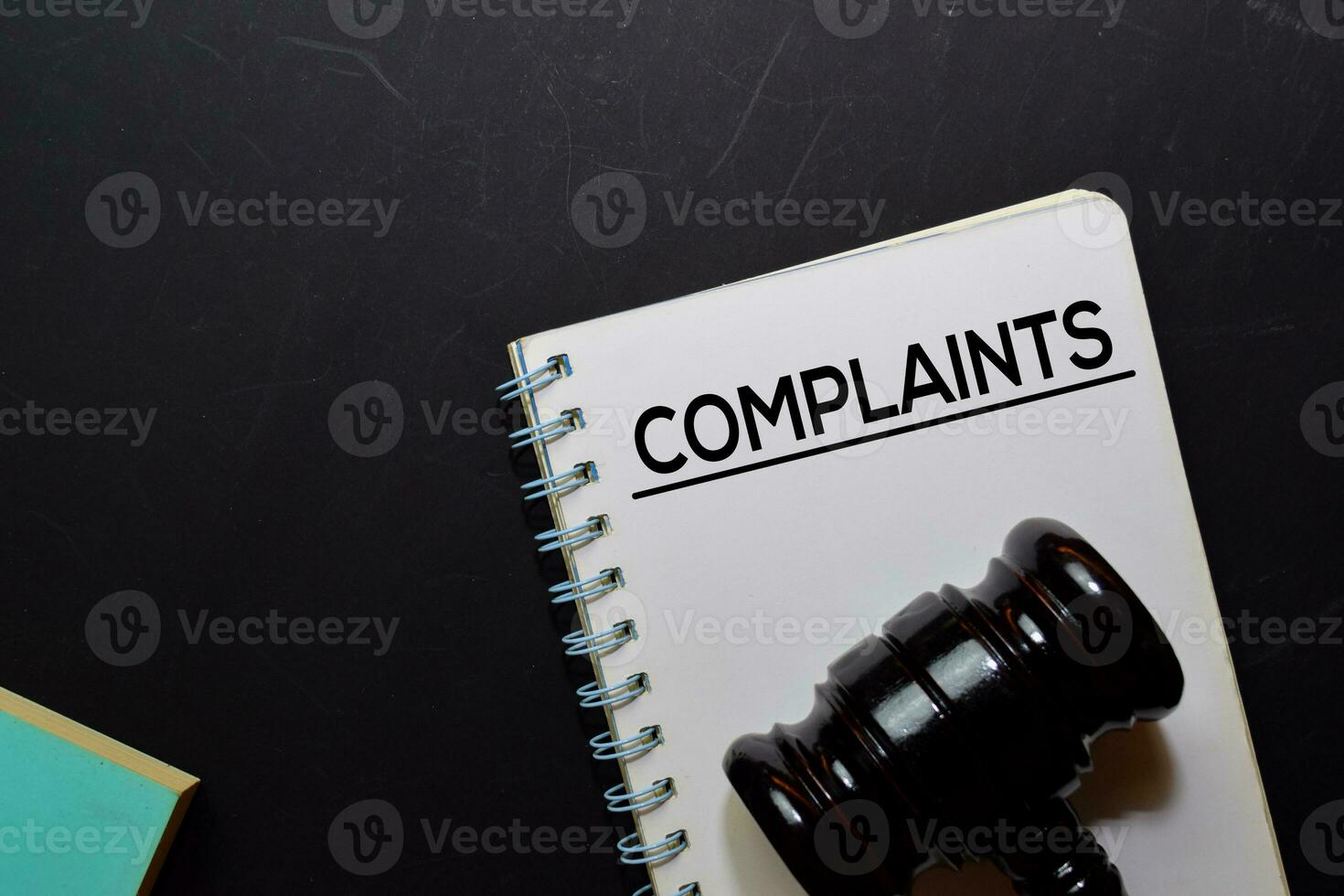 Complaints text on Document and gavel isolated on office desk. Law concept photo