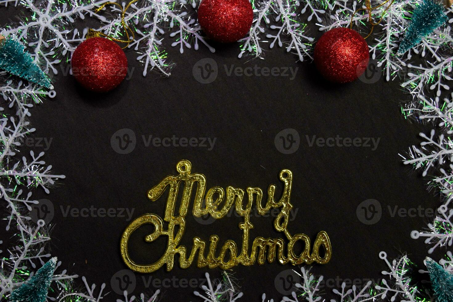 merry christmas text and Decorative Christmas isolated on black background photo