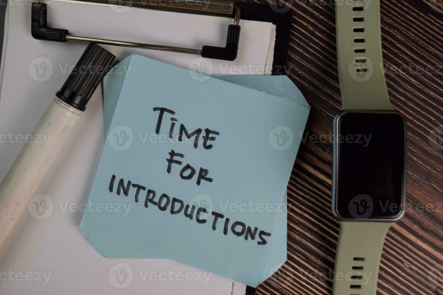 Time for Introductions write on sticky notes isolated on Wooden Table. photo