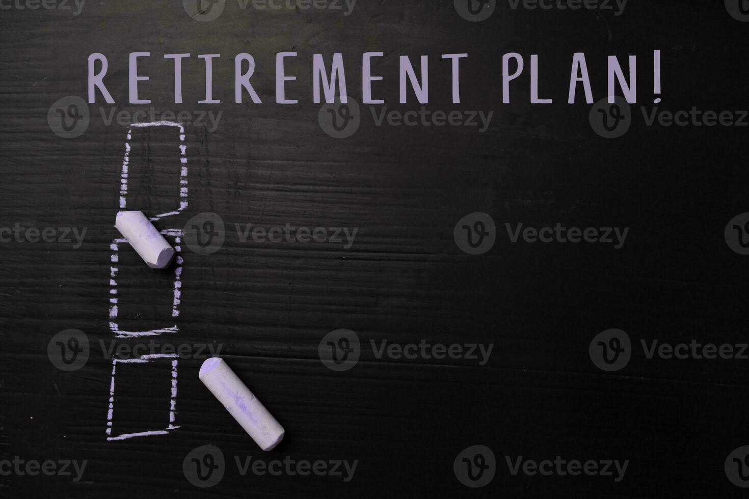 Retirement Plan written with color chalk. Supported by an additional services. Blackboard concept photo