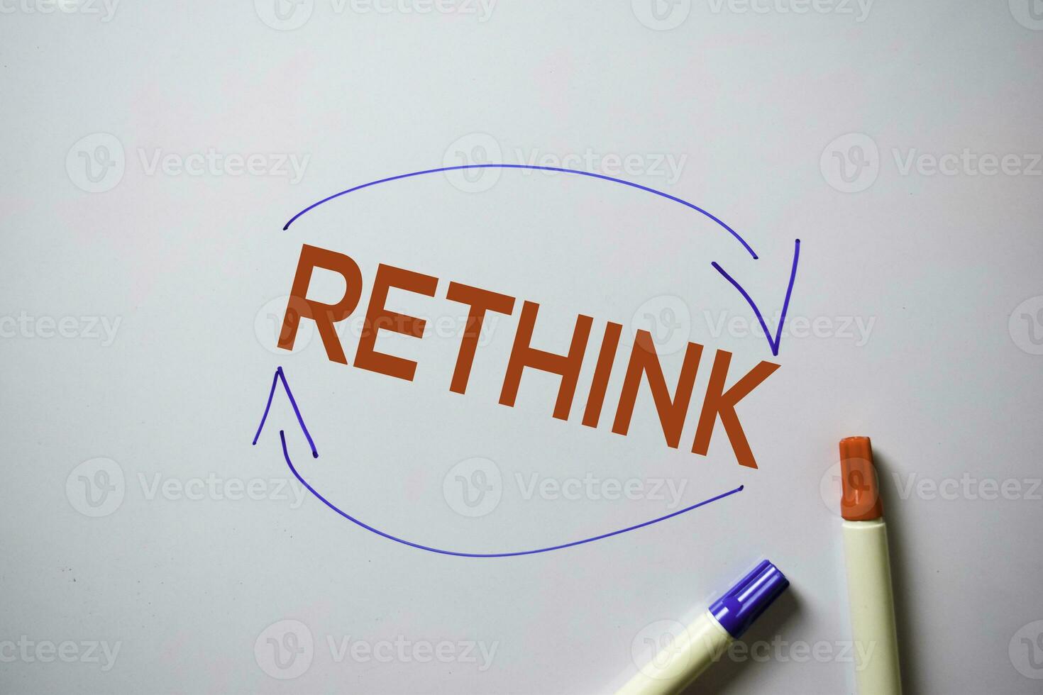 Rethink text with arrows isolated on white board background. photo