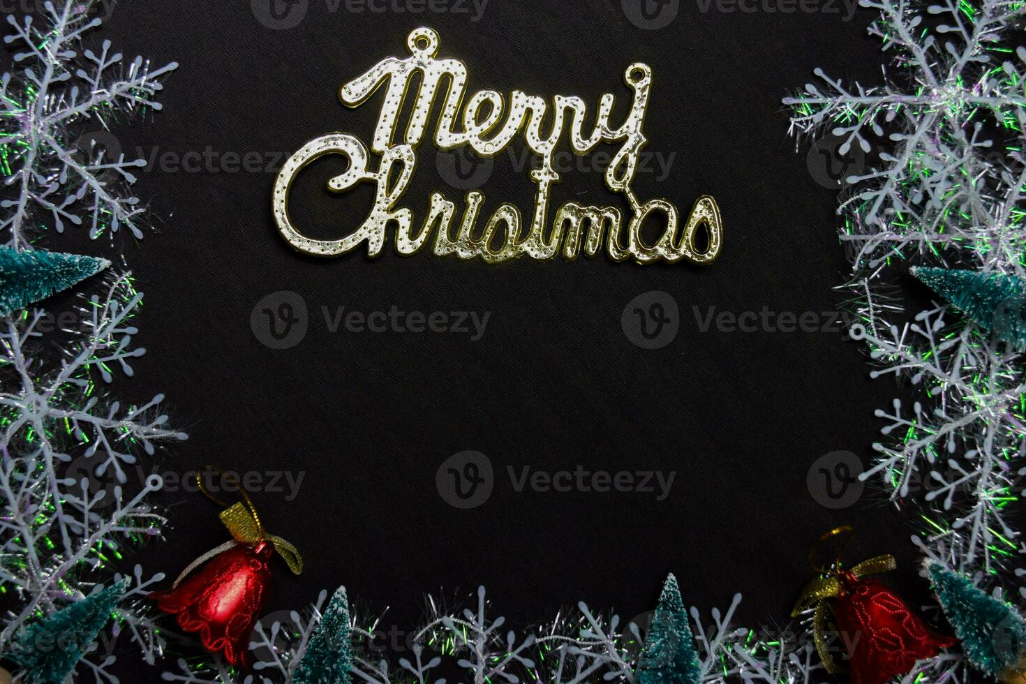 merry christmas text and Decorative Christmas isolated on black background photo
