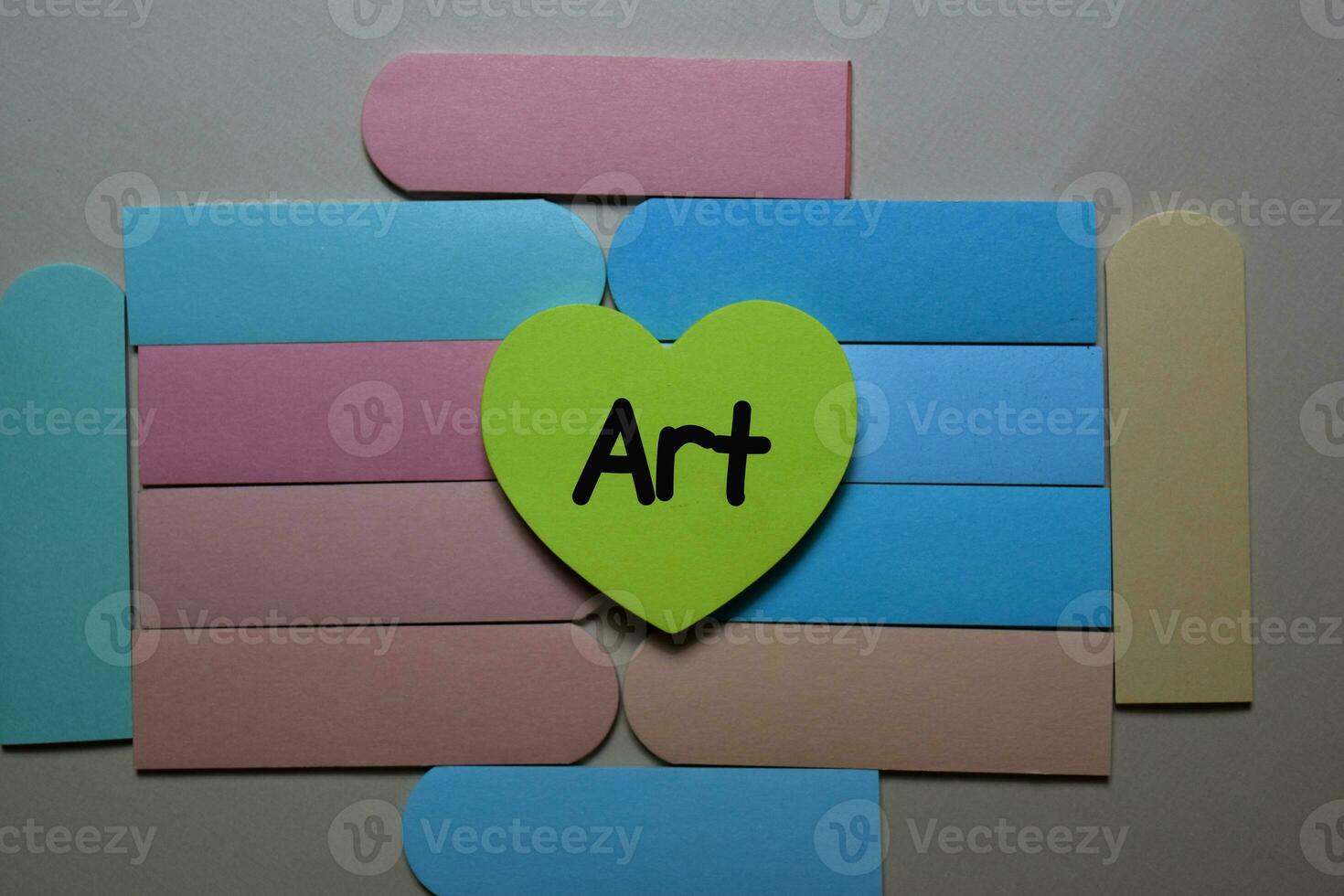 Art write on a sticky note isolated on office desk. photo