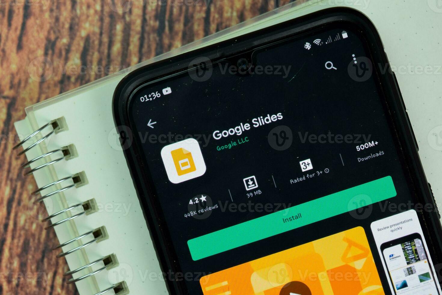 Google Slides dev app with magnifying on Smartphone screen. Google Slides is a freeware web browser developed by Google LLC. BEKASI, WEST JAVA, INDONESIA. NOVEMBER 29, 2020 photo