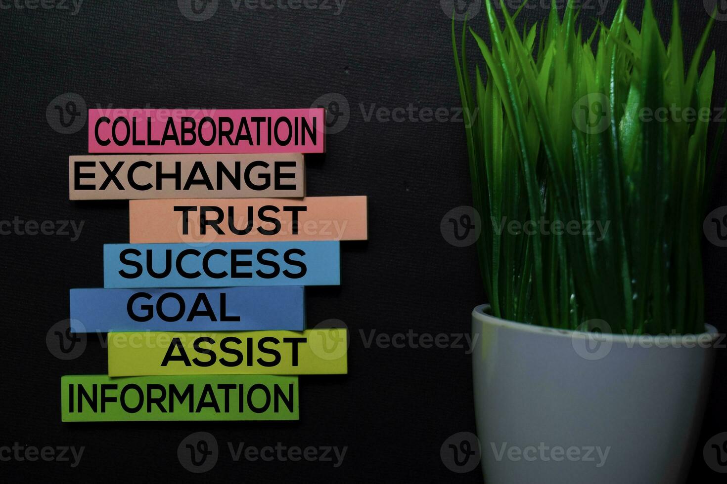 Collaboration, Exchange, Trust, Success, Goal, Assist, Information text on sticky notes isolated on Black desk. Mechanism Strategy Concept photo