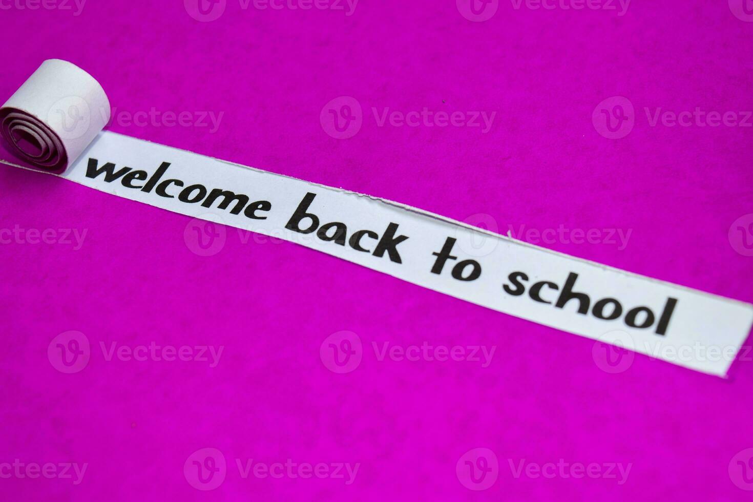 Welcome Back To school text, Inspiration, Motivation and business concept on purple torn paper photo