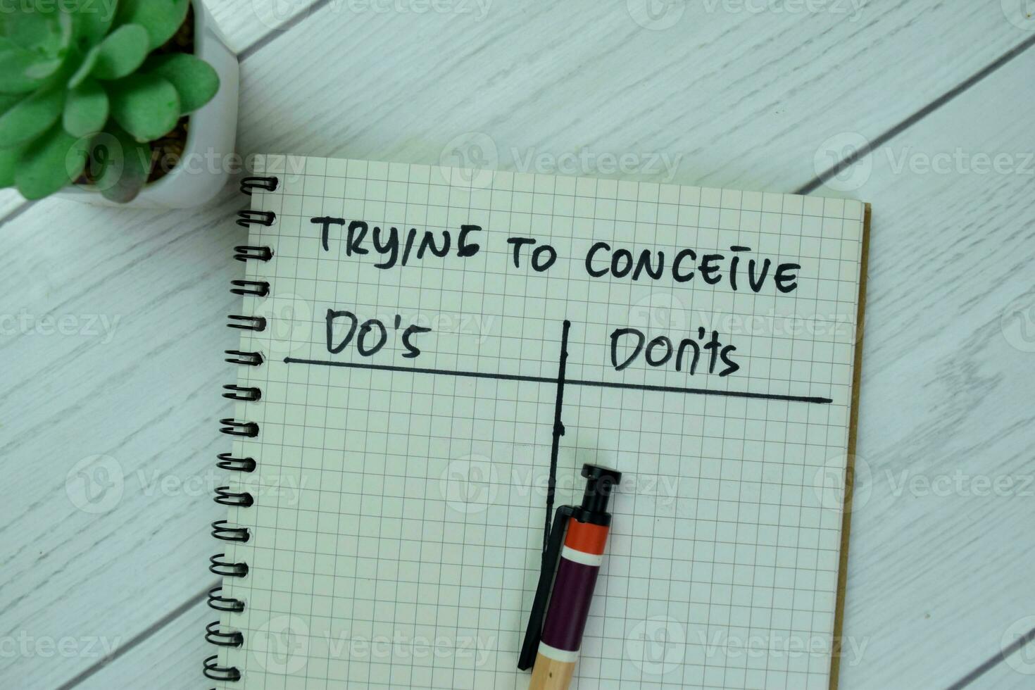 Concept of Trying to Conceive with Do's and Don'ts write on a book isolated on Wooden Table. photo