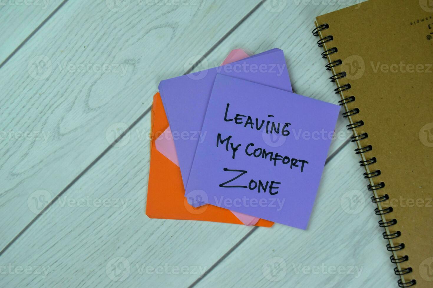 Concept of Leaving My Comfort Zone write on sticky notes isolated on Wooden Table. photo
