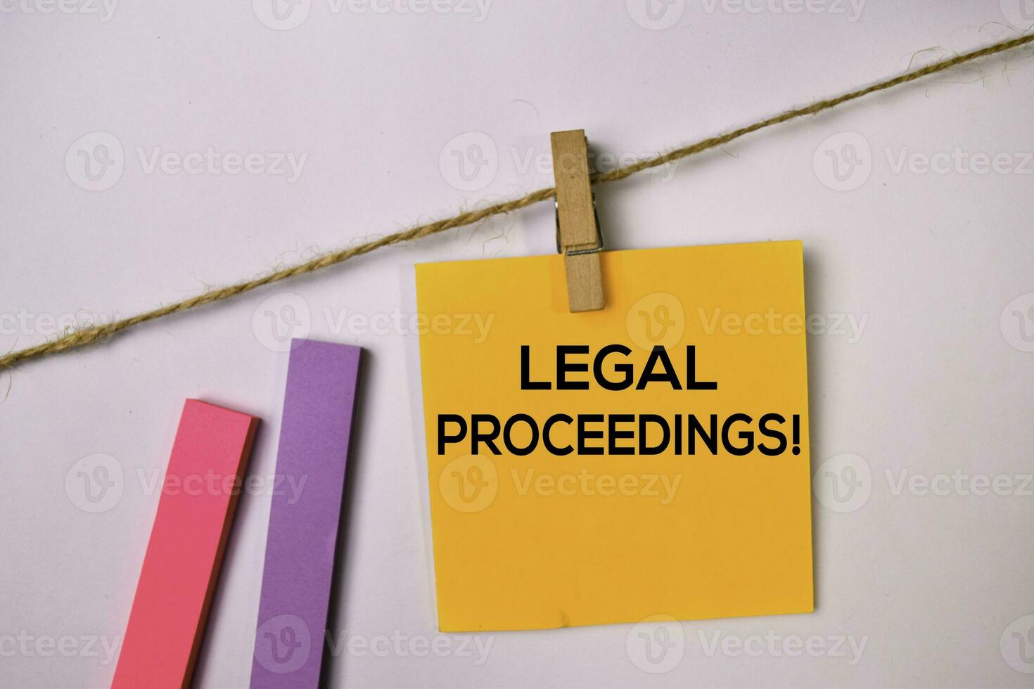 Legal Proceedings on sticky notes isolated on white background. photo