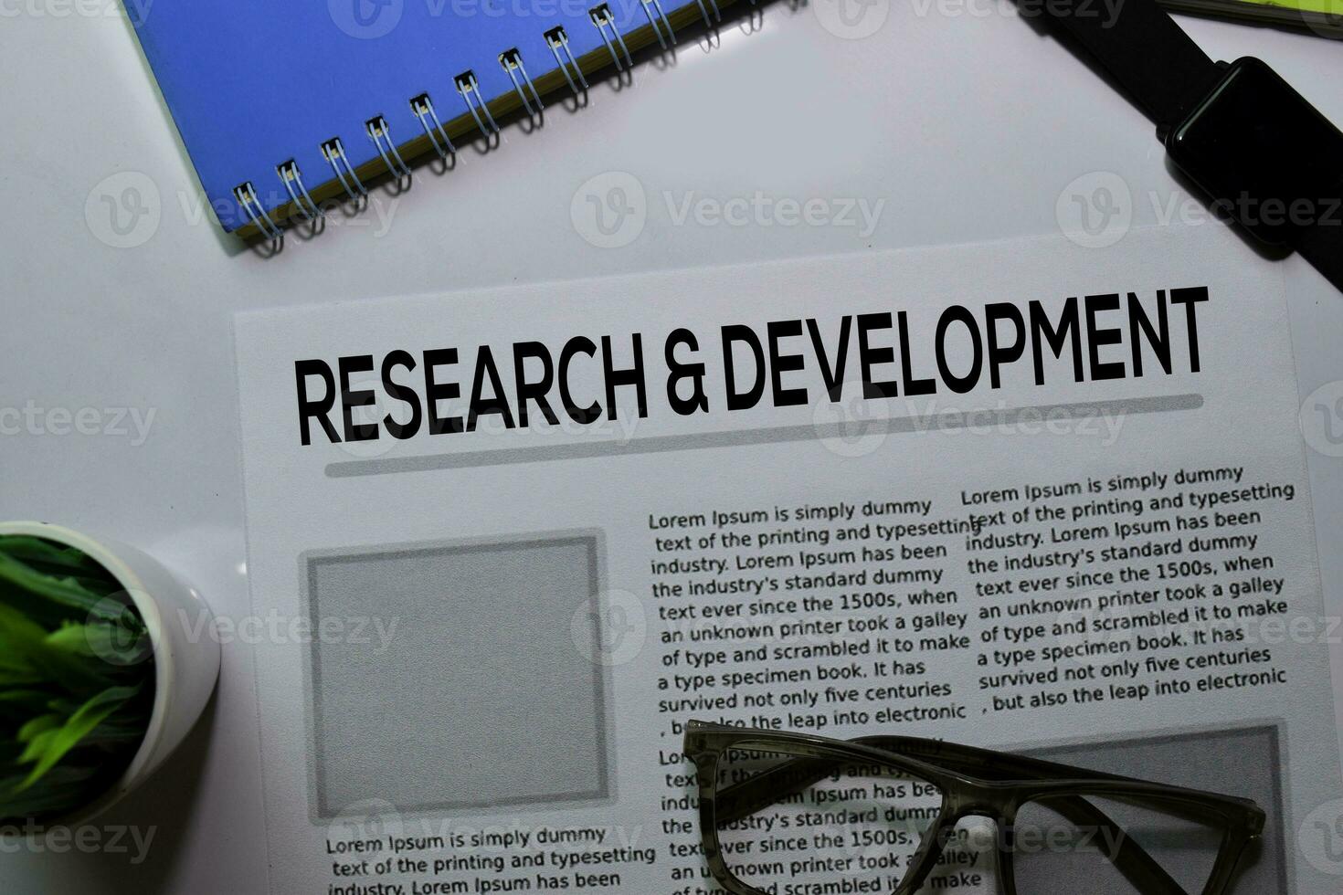Research and Development text in headline isolated on white background. Newspaper concept photo