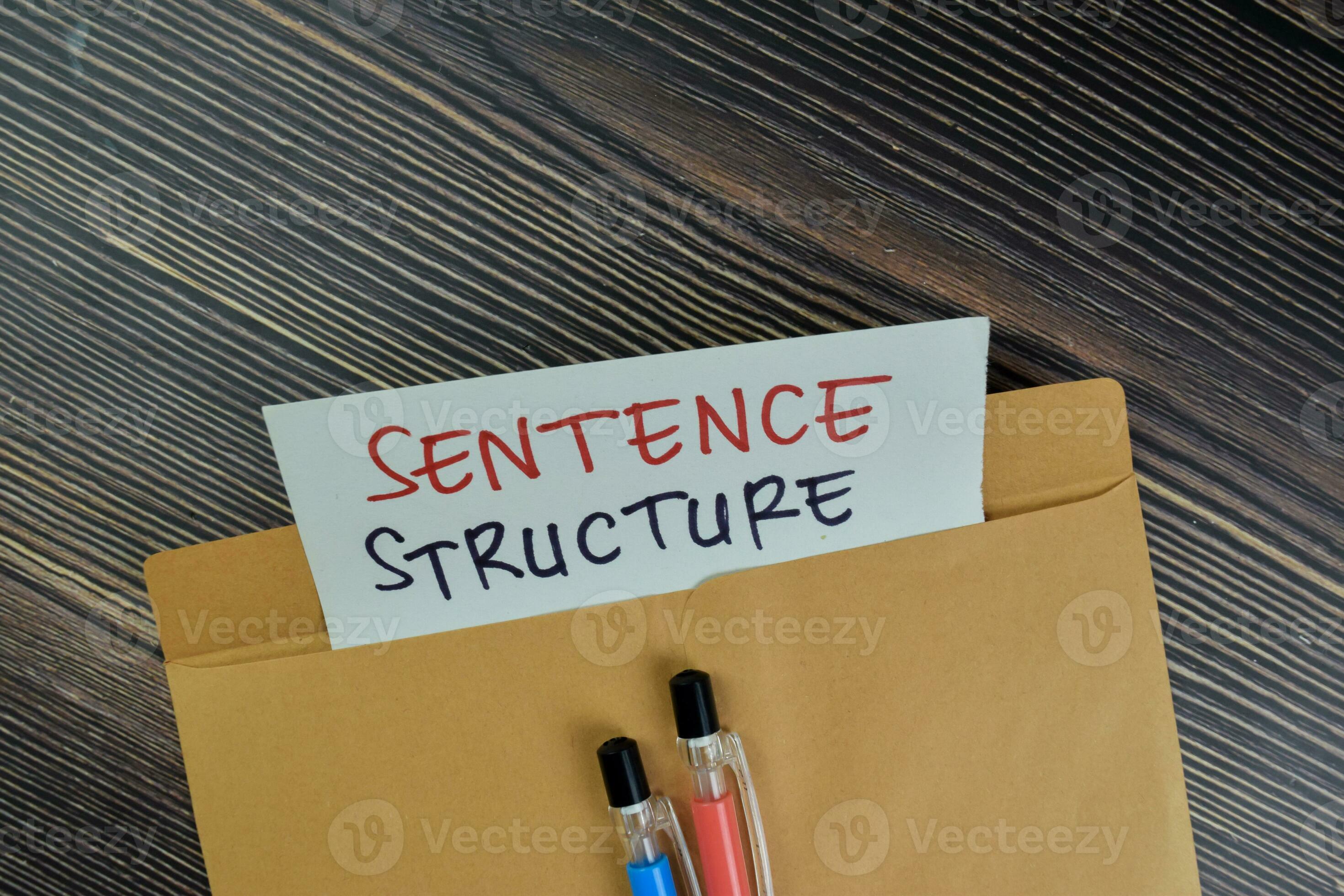 Sentence Structure text on document above brown envelope. 23671315