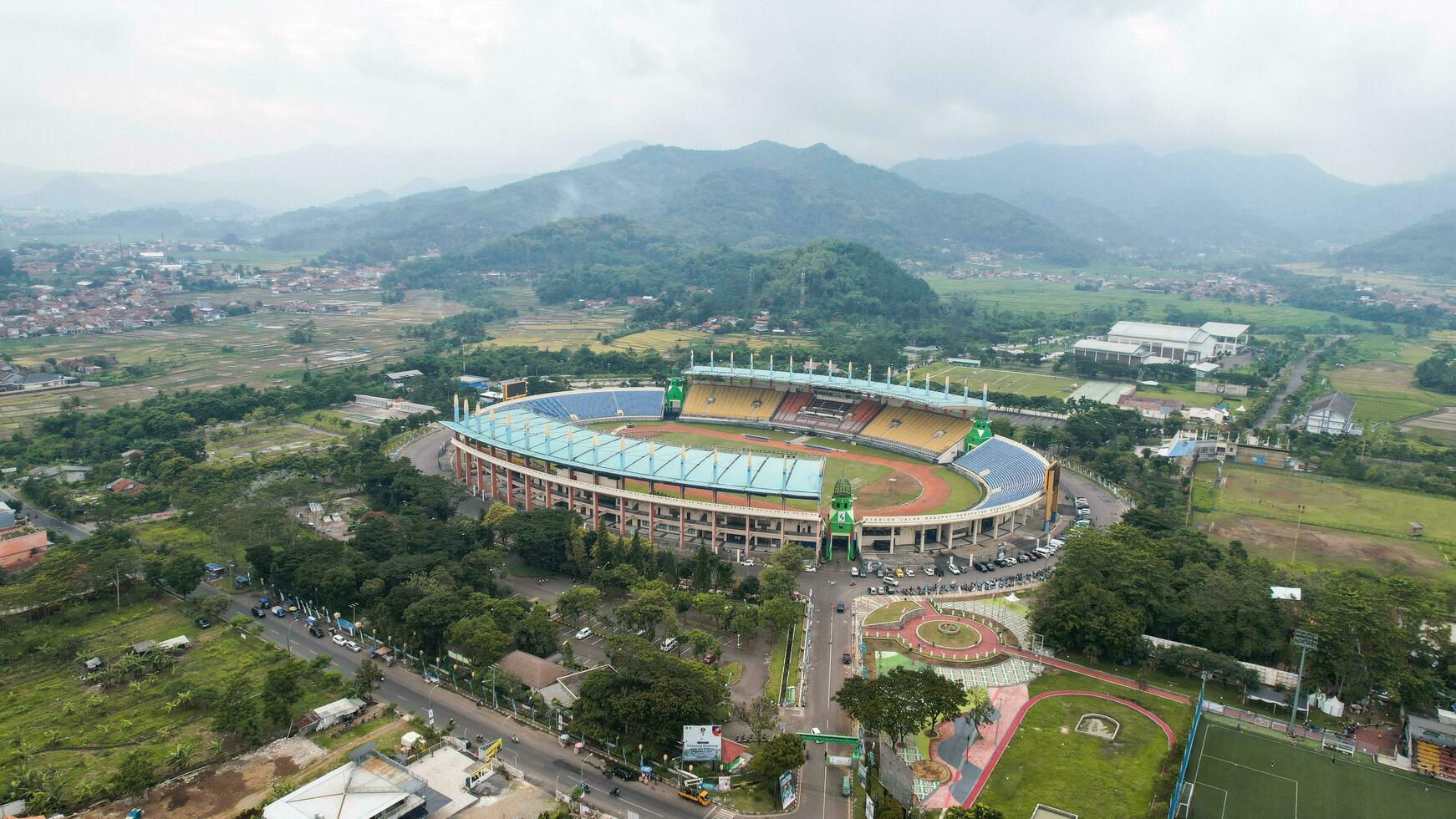 Aerial view of the Beautiful scenery Si Jalak Harupat Football or Soccer Stadium in the Morning with Blue Sky. Bandung, Indonesia, November 22, 2022 photo