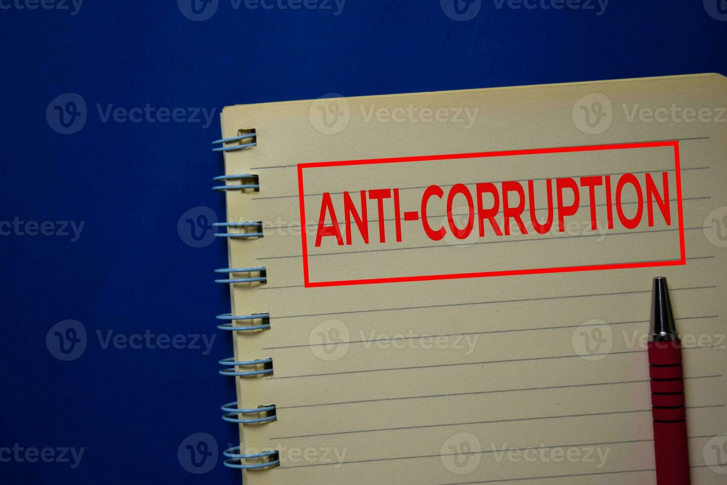 Anti-Corruption write on a book isolated on blue background. photo