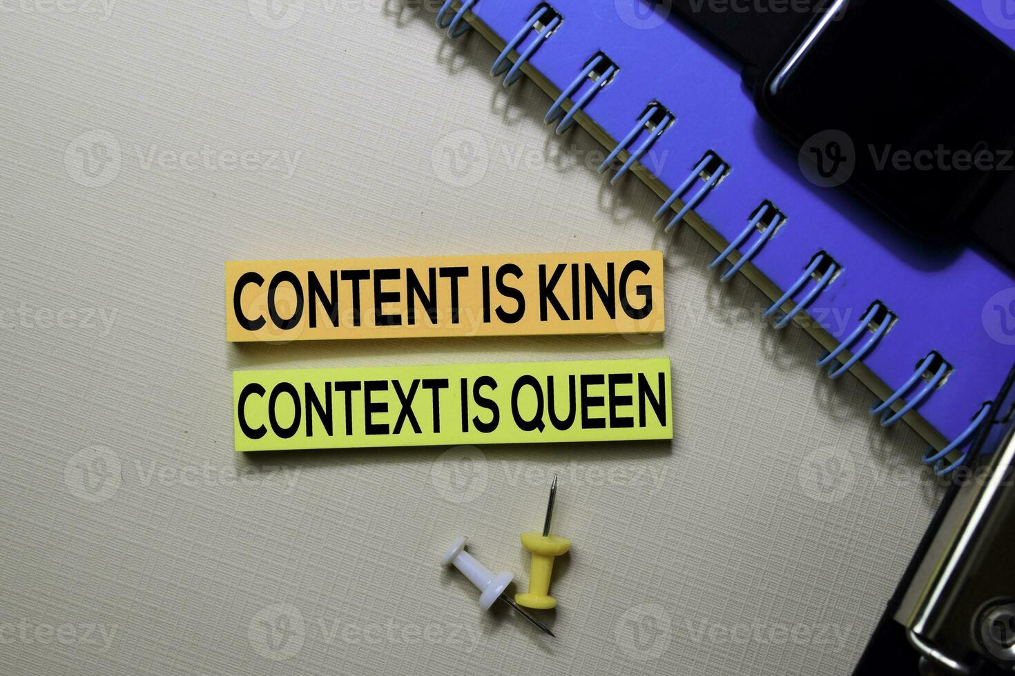 Content is King. Context Is Queen text on sticky notes isolated on office desk photo