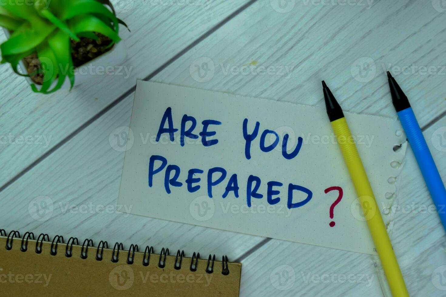 Concept of Are You Prepared write on sticky notes isolated on Wooden Table. photo