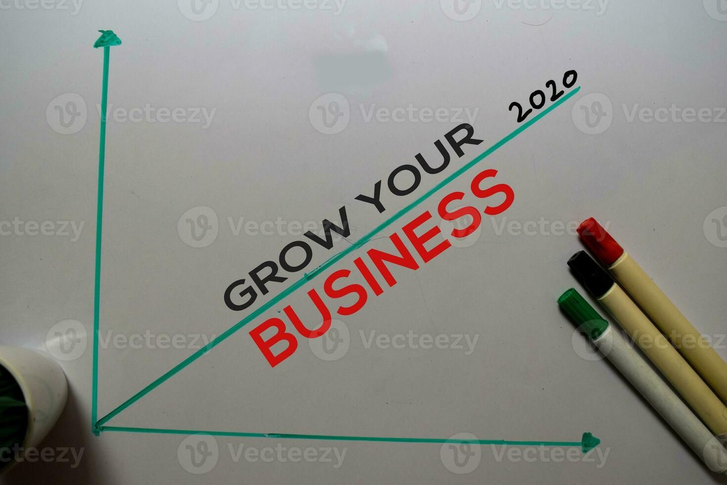 Grow Your Business 2020 write on white board background. Chart or mechanism concept photo