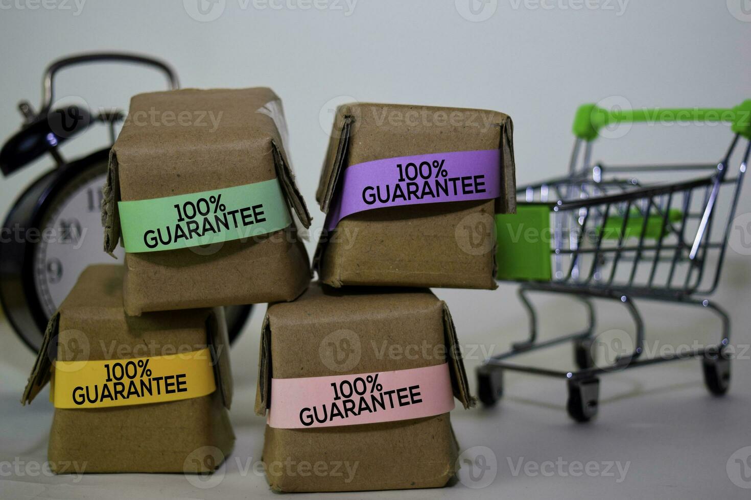 Guarantee Text in small boxes and shopping cart. Concepts about online shopping. Isolated on white background photo