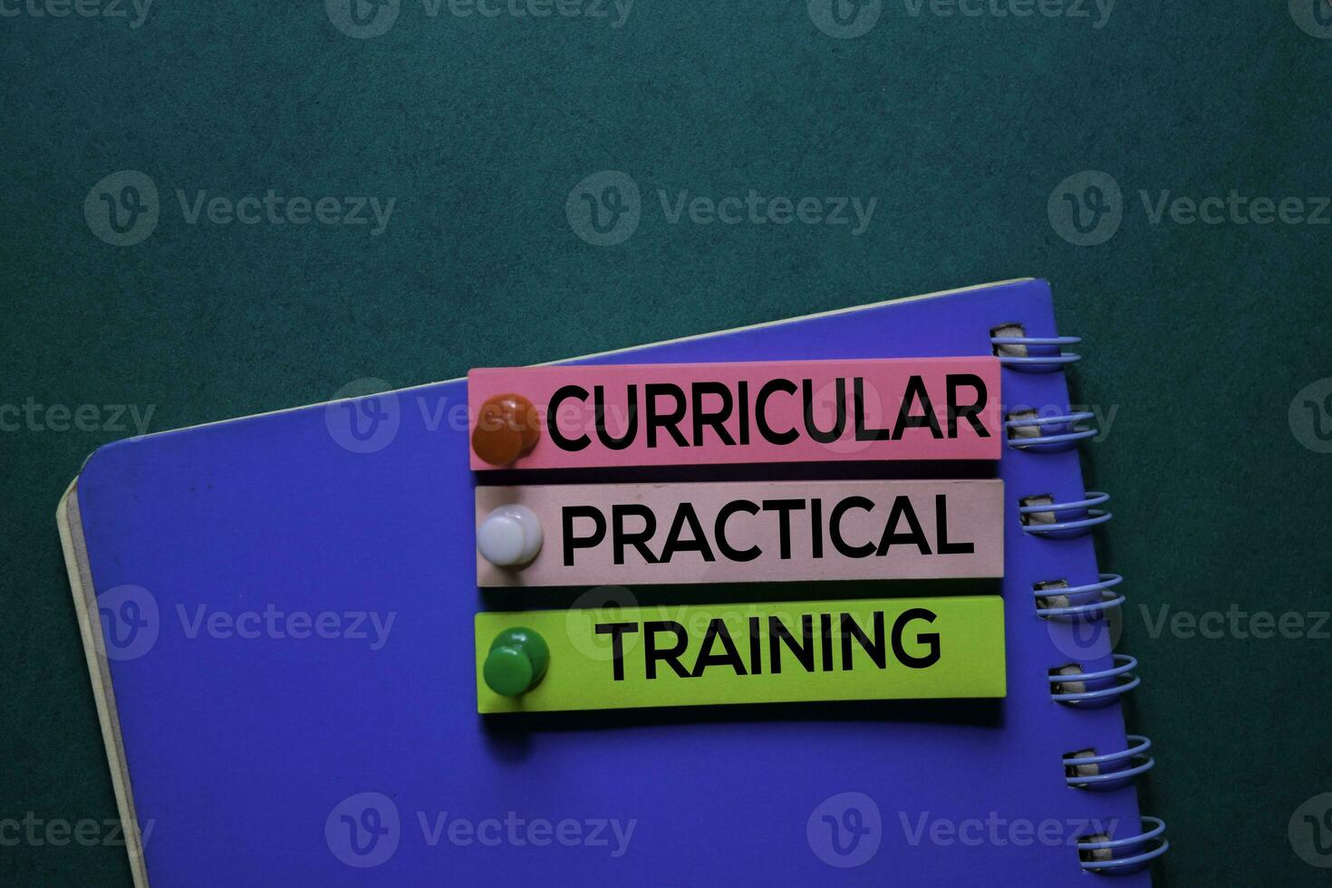Curricular Practical Training text on sticky notes. Office desk background. photo