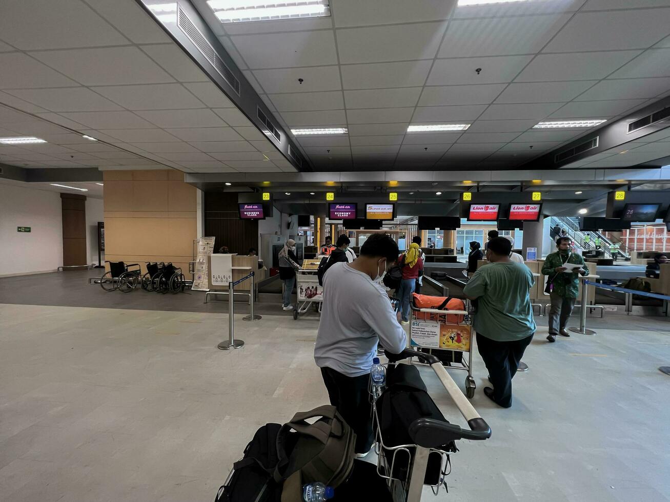 people waiting to board plane at Praya Lombok airport. Lombok, Indonesia, March 22, 2022 photo