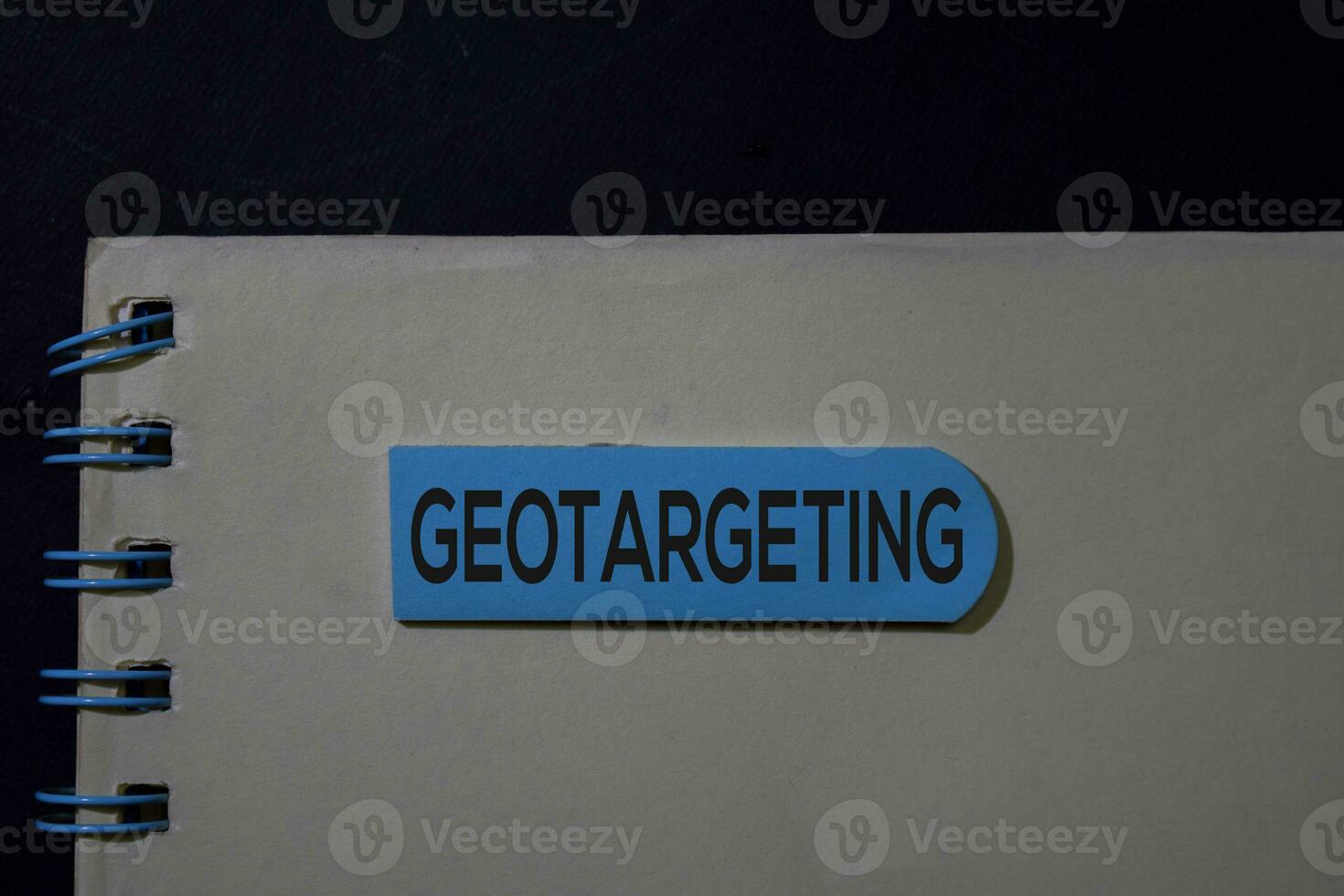 Geotargeting write on sticky note isolated on Office Desk photo