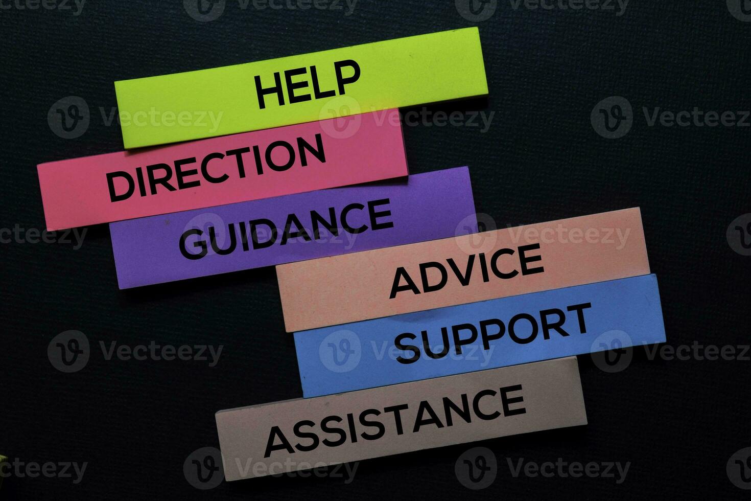help-direction-guidance-advice-support-advice-assistance-text-on-sticky-notes-isolated-on-black-desk-mechanism-strategy-concept-photo.jpg