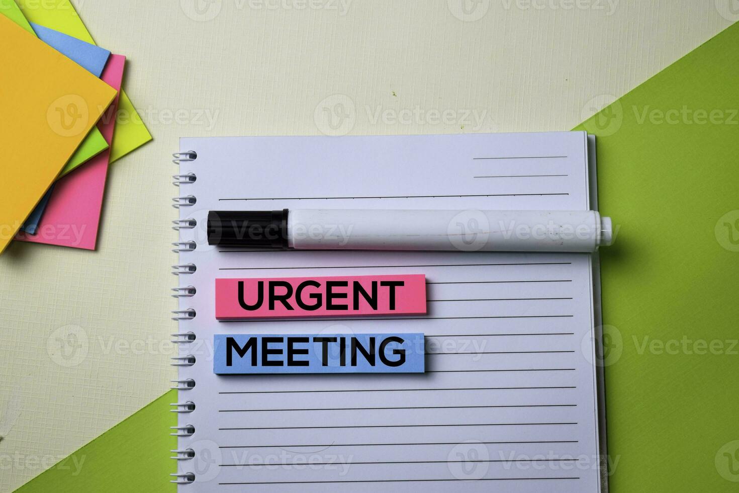 Urgent Meeting text on top view office desk table of Business workplace and business objects. photo