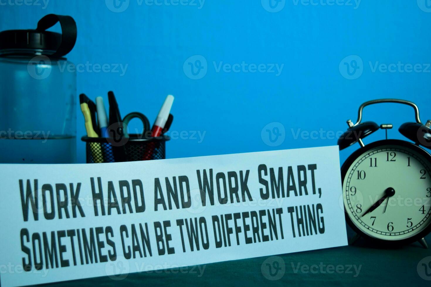 Work Hard and Work Smart, Sometimes can be two different thing Planning on Background of Working Table with Office Supplies. Business Concept Planning on Blue Background photo
