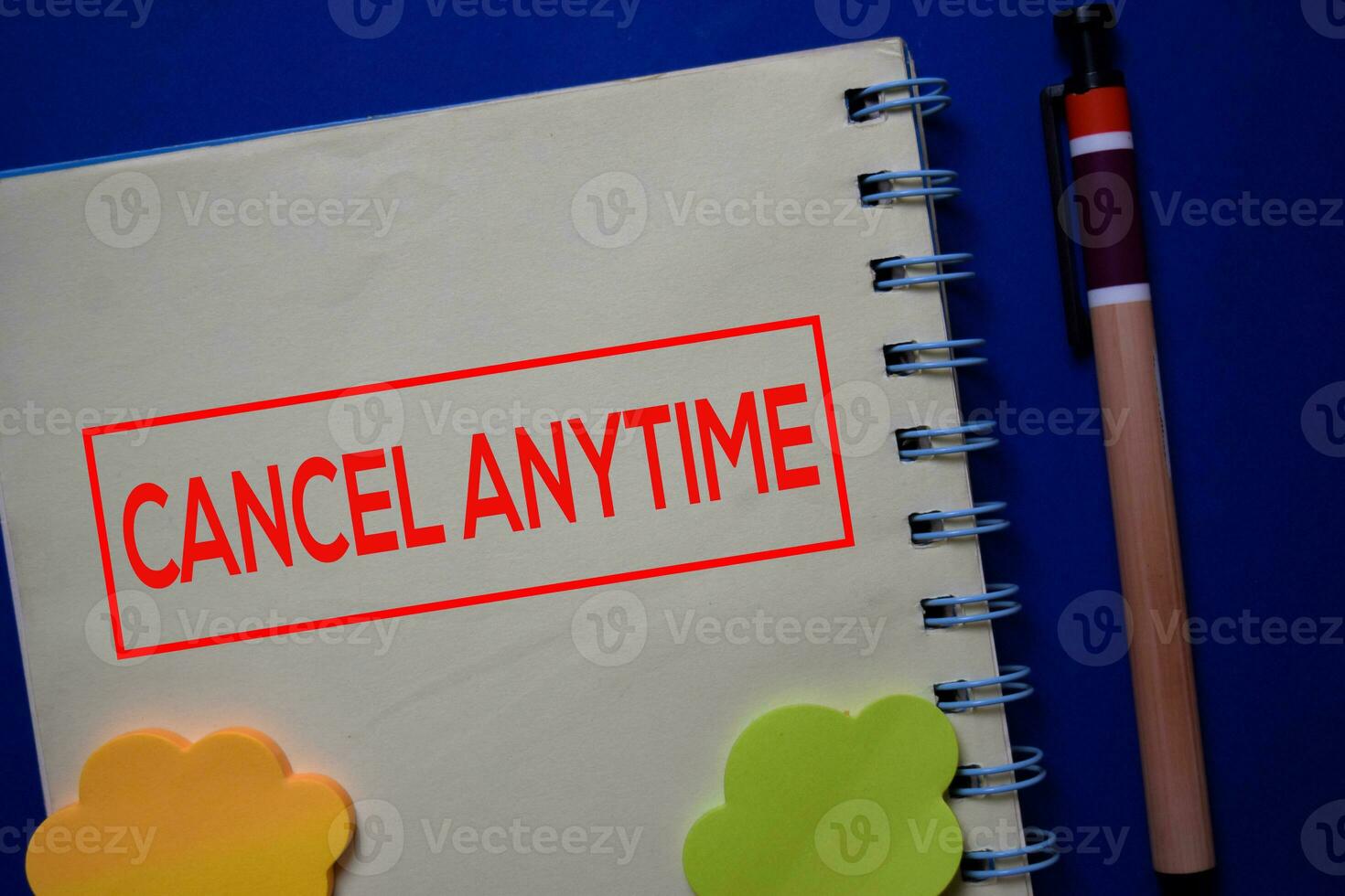 Cancel Anytime write on a book isolated on blue background. photo