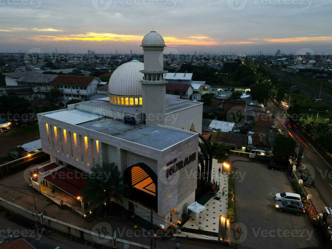 Nurani Mosque panorama view Largest Mosque in Bekasi. Ramadan and Eid Concept and noise cloud when sunset or sunrise view. Bekasi, INDONESIA - JANUARY, 8, 2021 photo