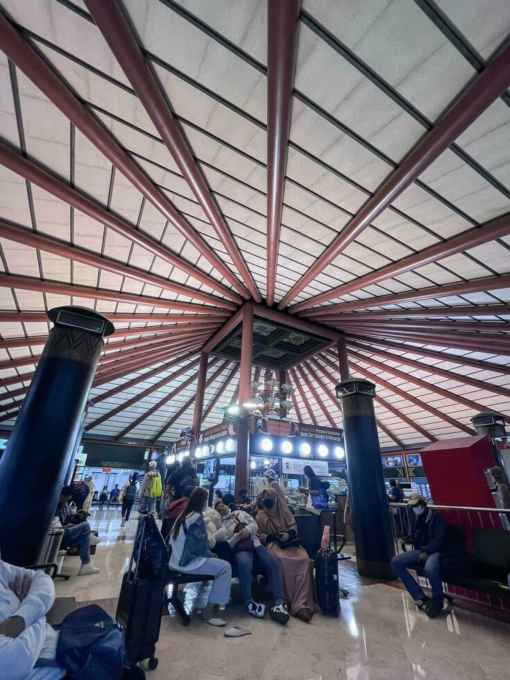 people waiting to board plane at Soekarno Hatta airport. Jakarta, Indonesia, March 22, 2022 photo