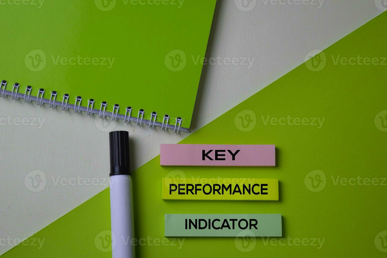 Key Performance Indicator text on top view office desk table of Business workplace and business objects. photo