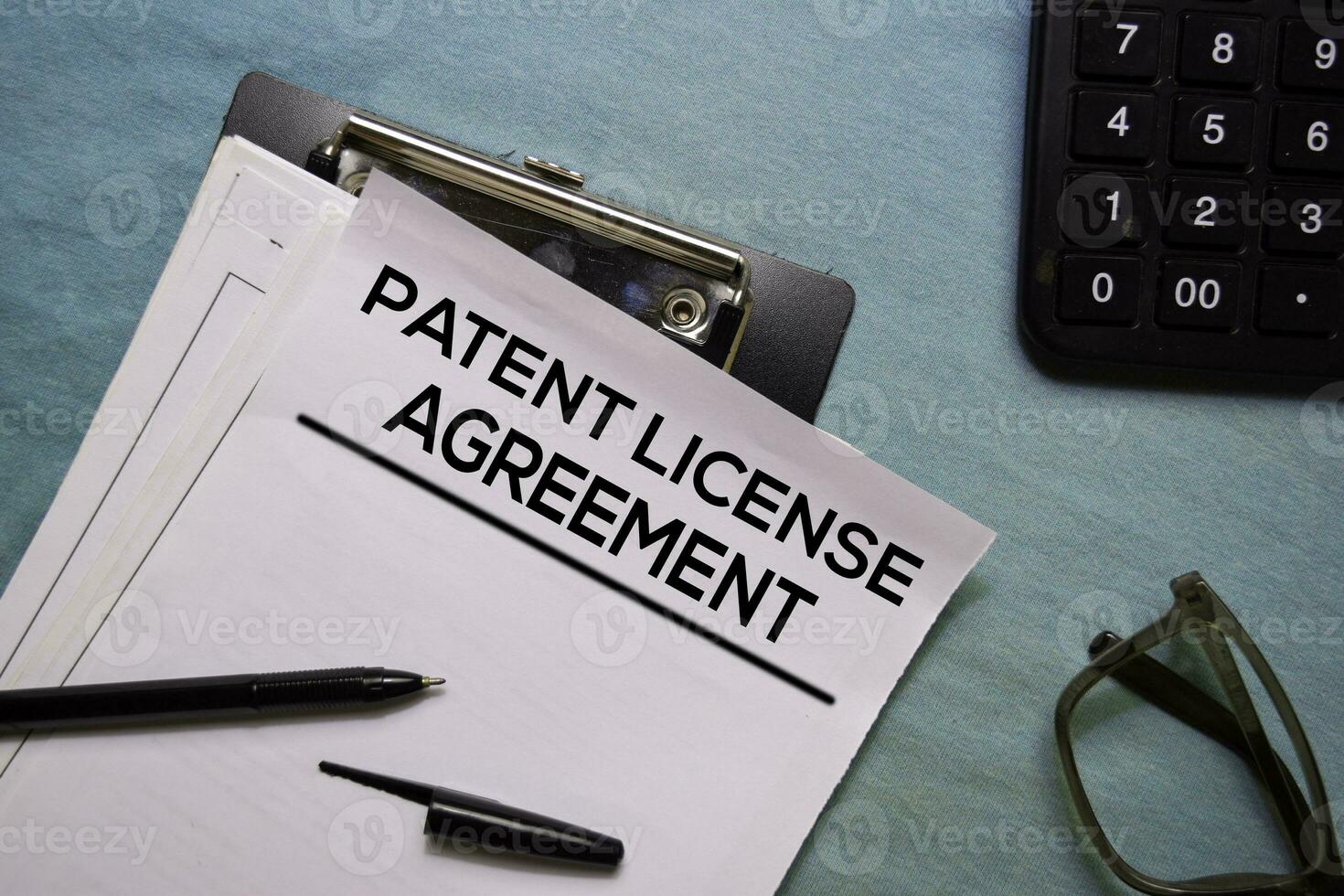 Patent Licence Agreement text on Document form isolated on office desk. photo