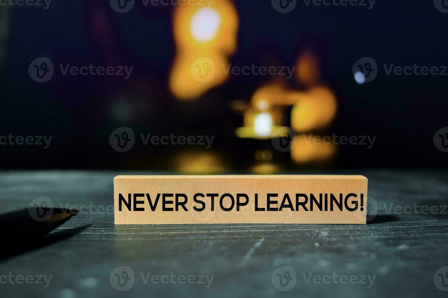 Never Stop Learning on the sticky notes with bokeh background photo
