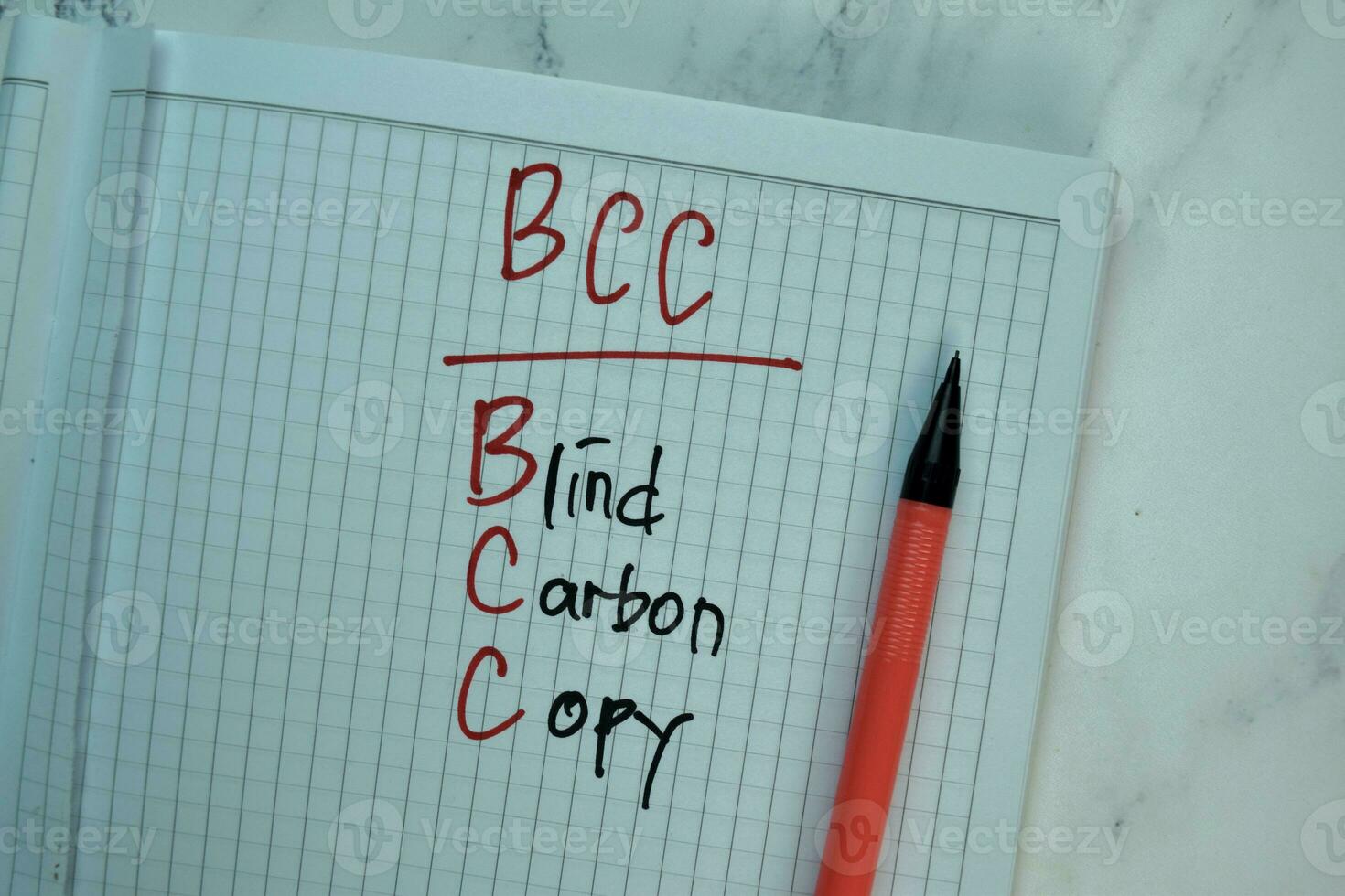 BCC - Blind Carbon Copy write on a book isolated on Wooden Table. photo