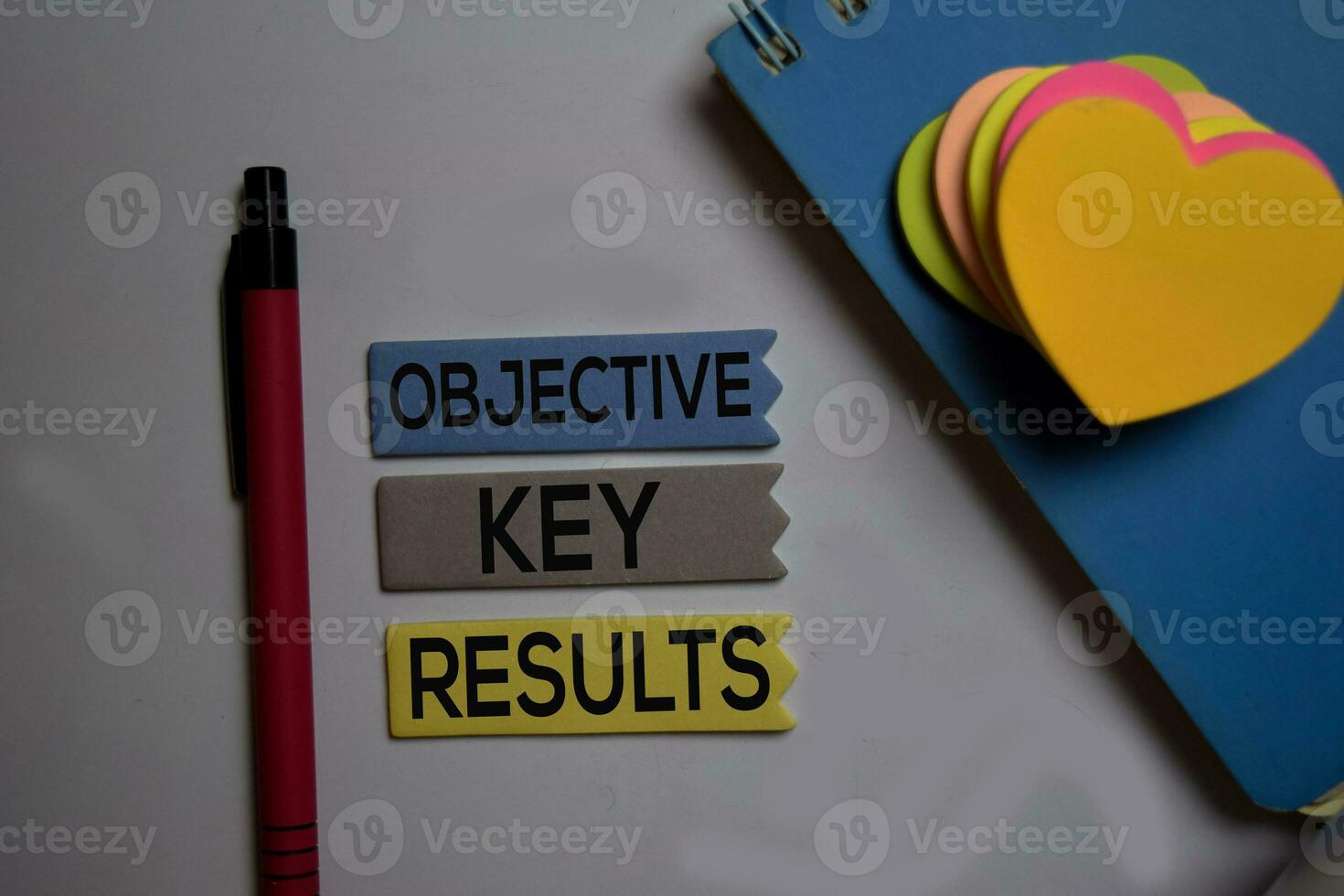 Objective Key Results - OKR text on sticky notes isolated on office desk photo