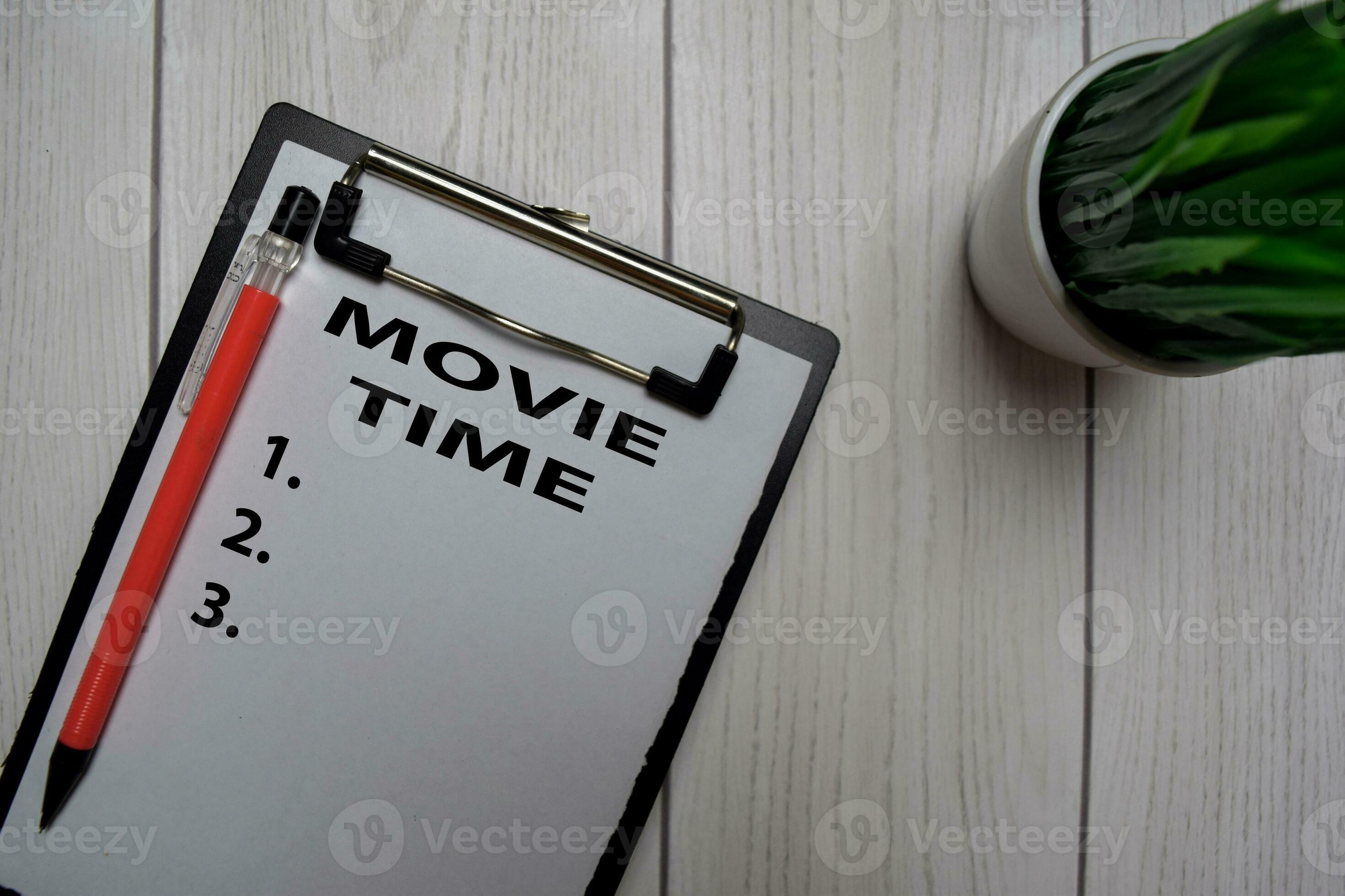 Movie Time and List Number write on a paperwork isolated on office desk