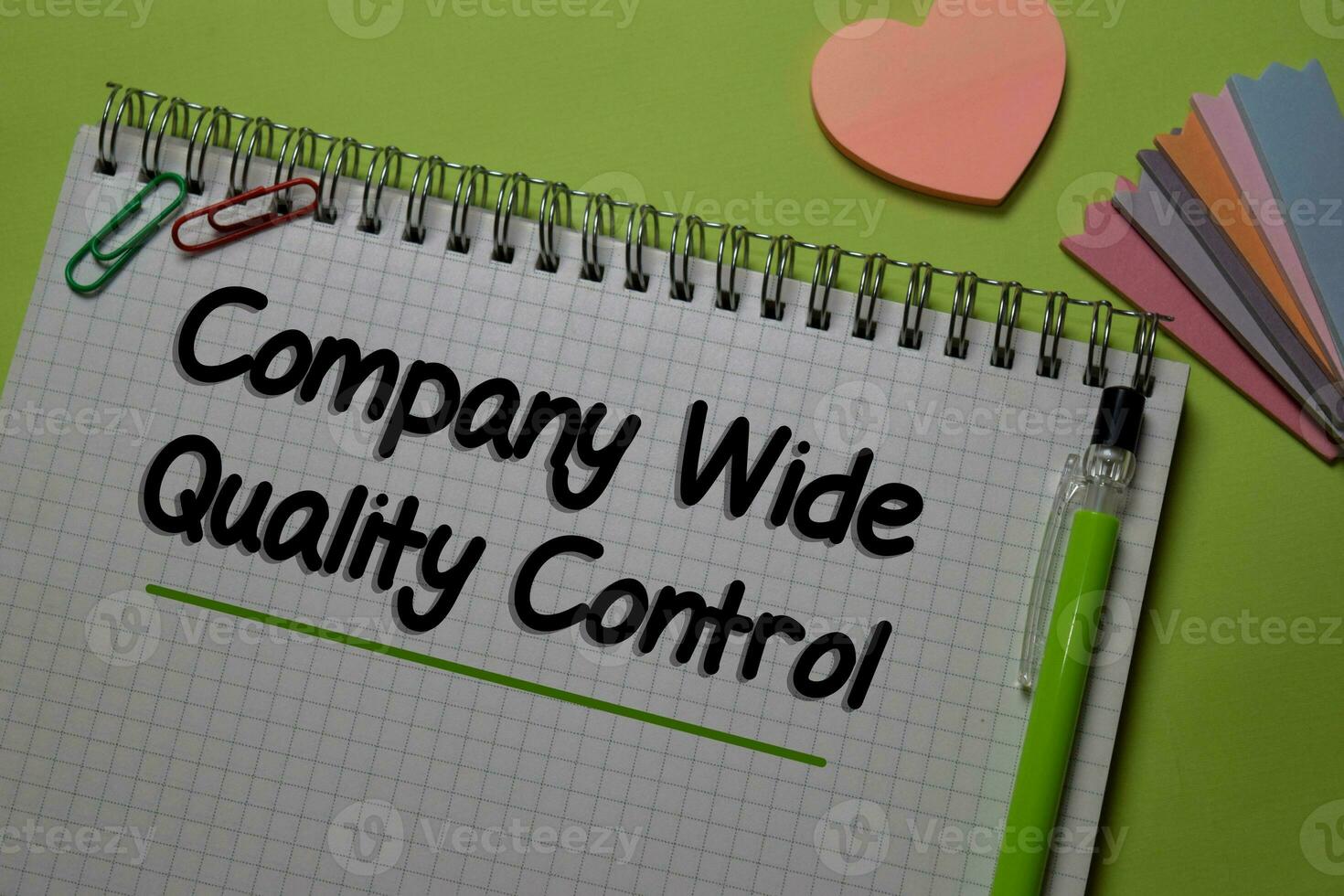 Company Wide Quality Control write on a book isolated on office desk. photo