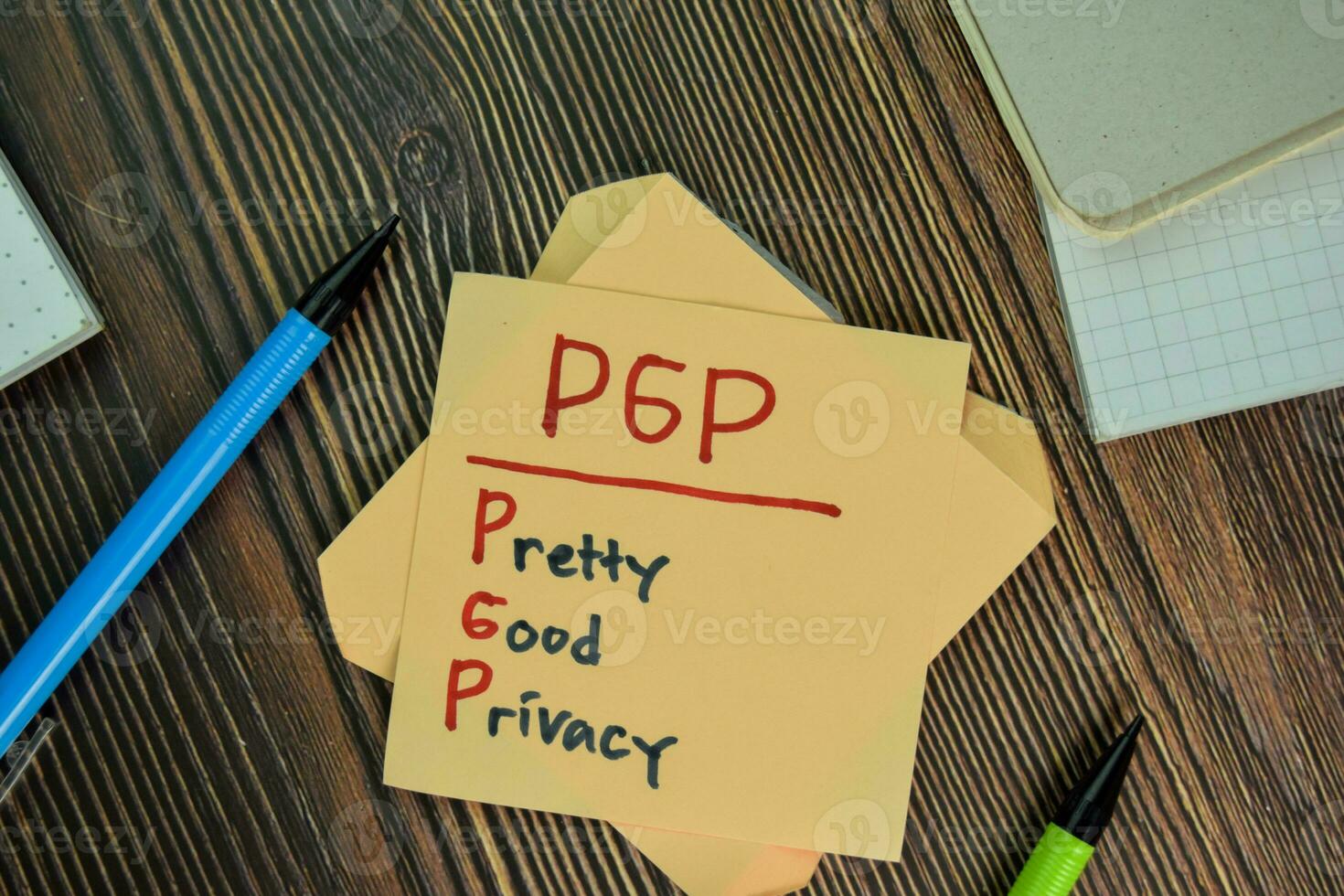 PGP - Pretty Good Privacy write on sticky notes isolated on Wooden Table. photo