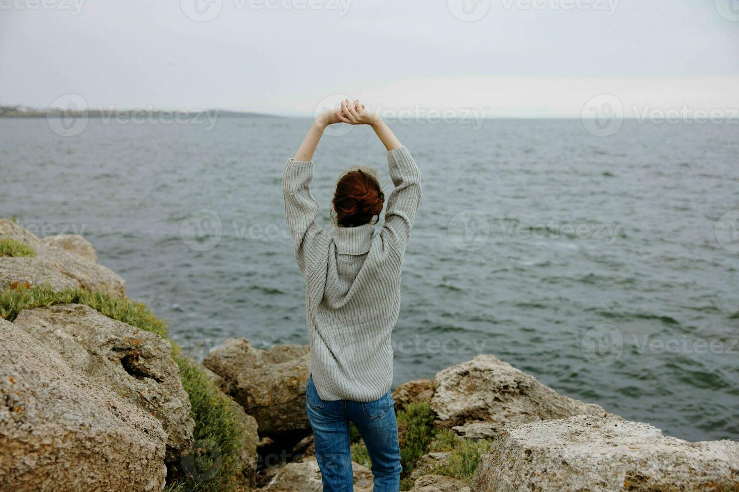 beautiful woman beach tourism cloudy weather stone coast Relaxation concept photo