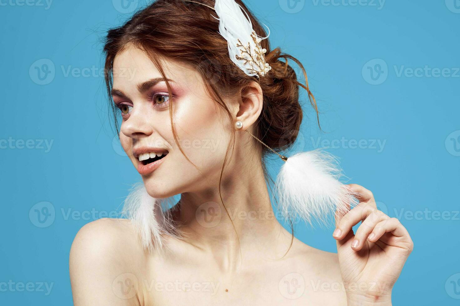 glamorous woman bright makeup decoration posing blue background photo