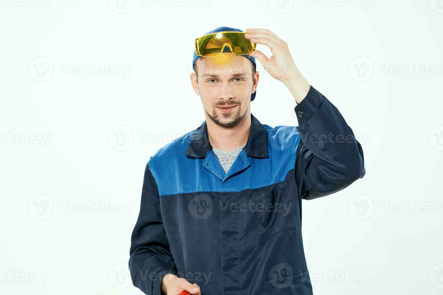 man in working uniform home repair painting service photo