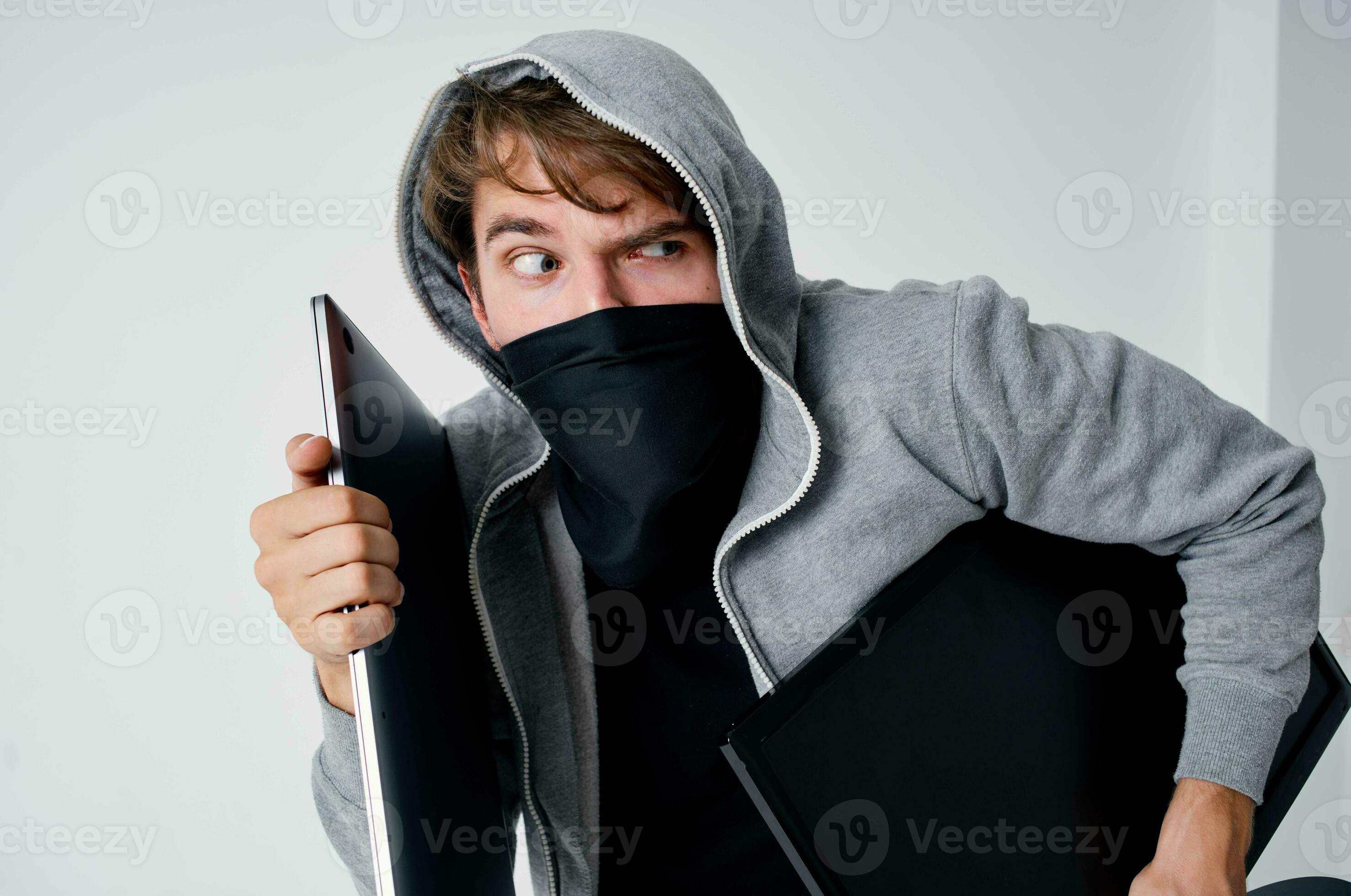 masked man stealth technique robbery safety hooligan light background