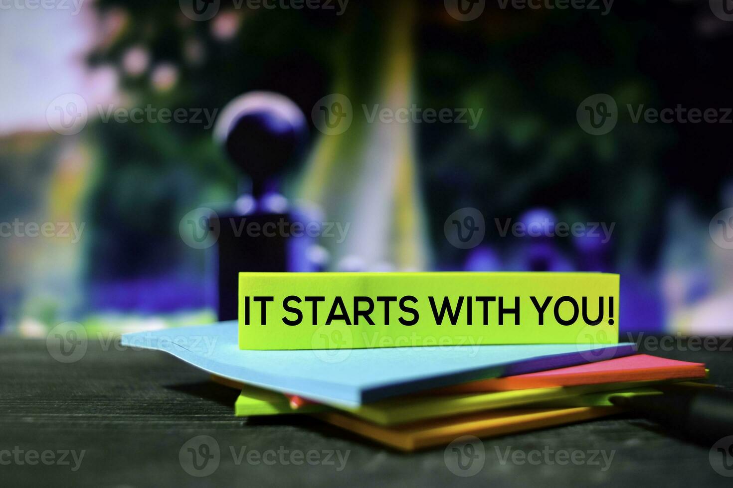 It Starts With You on the sticky notes with bokeh background photo