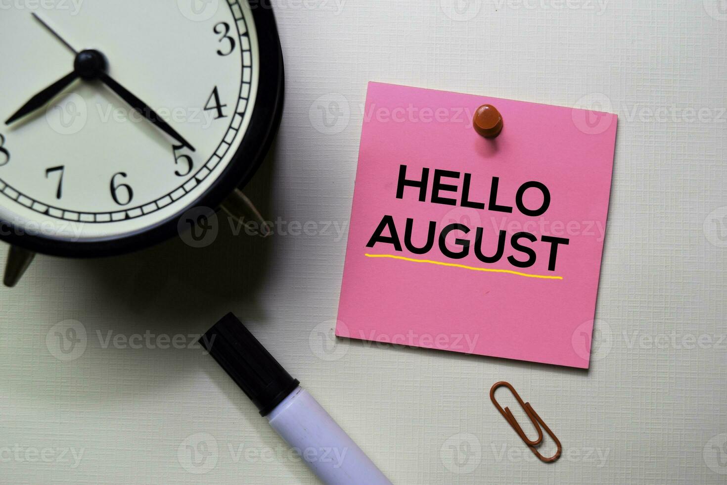 Hello August text on sticky notes isolated on office desk photo