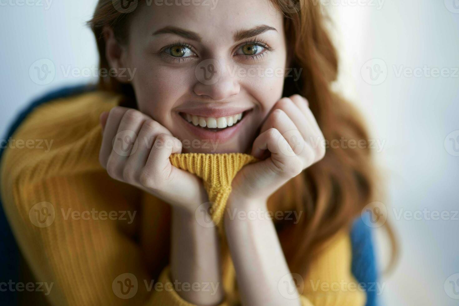 beautiful woman sitting near the window with a blue plaid dreamy look photo