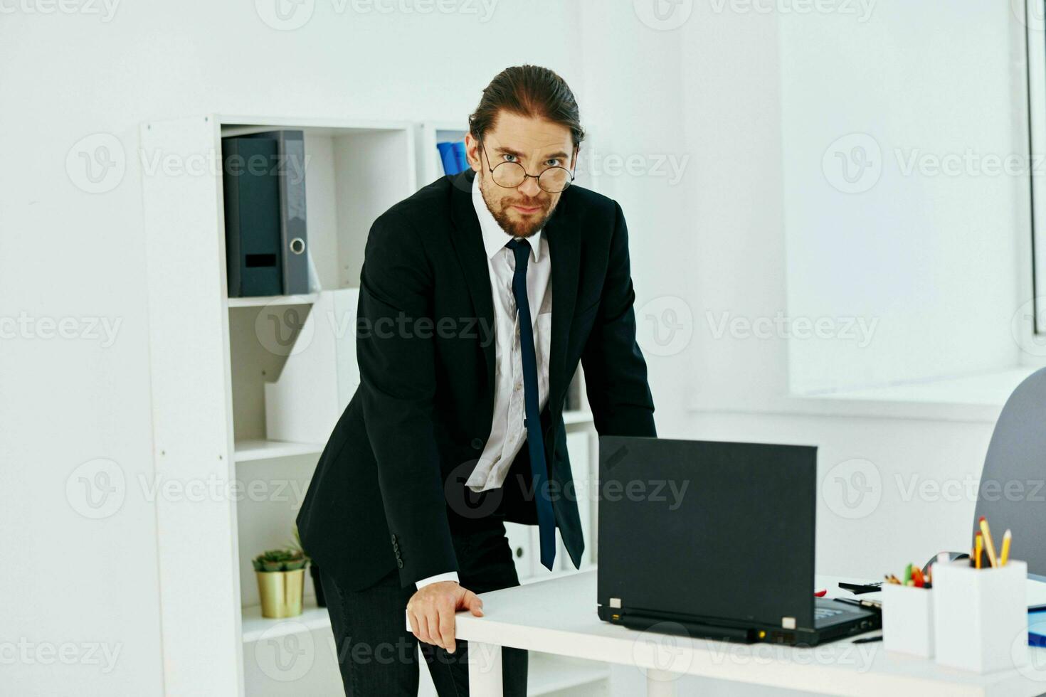 man in a suit holding a phone telephone office lifestyle photo