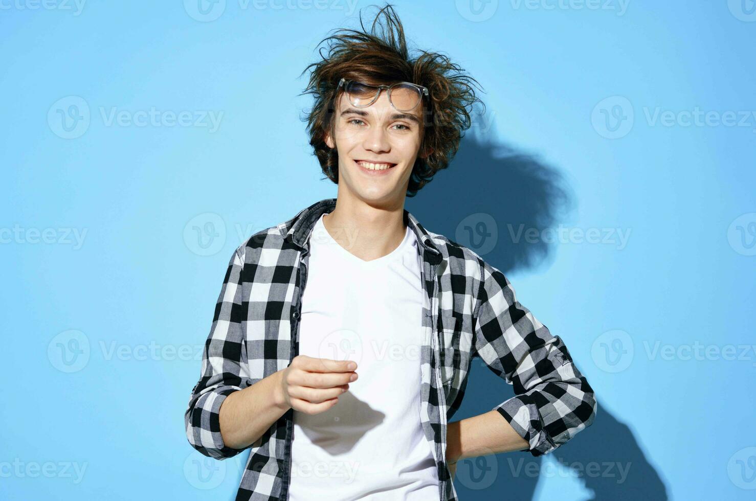 handsome man in plaid shirt glasses fashion blue background photo