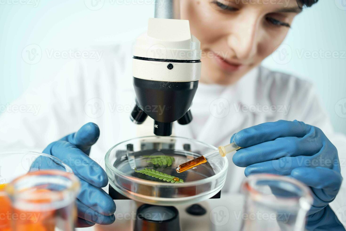 Laboratory technician blue gloved microscope professional technology photo